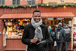 Portrait of young man smiling at market