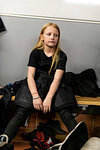 Girl in changing room prepares for ice hockey training