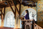 Priest at altar in church