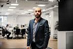 Portrait of bearded man in office