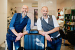 Happy business partners in barber shop