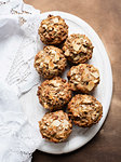 Still life of wholemeal muffins on plate, overhead view