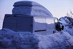 Van in deep snow with snow covered roof, Alpe-d'Huez, Rhone-Alpes, France