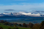 Scenic landscape with distant snow capped mountains, Llanberis, Gwynedd, Wales