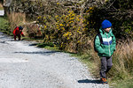 Boys exploring national park, Llanaber, Gwynedd, United Kingdom