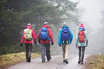 Family hiking in rain