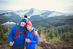 Happy couple hiking on mountaintop