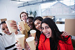 Portrait happy businesswomen celebrating new office