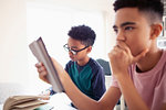 Teenage boys doing homework