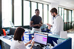 Doctor speaking with patient at hospital reception