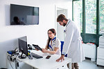 Doctor and nurse using digital tablet in hospital