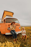 Mother with daughter on road trip in countryside