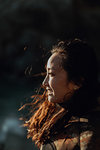 Woman enjoying breeze on beach