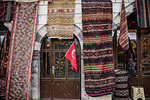 Display of variety of rugs and runners on facade of shop, Goreme, Cappadocia, Turkey