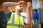 Male electrician student using screwdriver