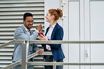 Couple using smart phone outdoors