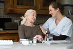 Senior patient talking with nurse