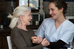 Senior patient talking with nurse