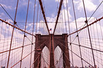 Brooklyn Bridge against cloudy sky