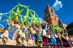 Group of people wearing traditionl costumes in the La Resena Parade in San Miguel de Allende, Guanajuato, Mexico