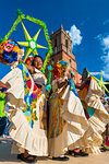 Women in traditional dresses, dancing in the La Resena Parade in San Miguel de Allende, Guanajuato, Mexico