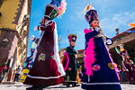 People wearing nobleman's costumes in a St Michael Archangel Festival parade in San Miguel de Allende, Mexico