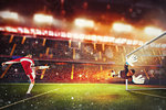 Football scene with a player who kicks a fiery ball into the opponent goal