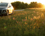 car in nature with the sunrise