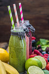 Healthy Fresh Smoothies and Fruit on Rustic Wooden Background