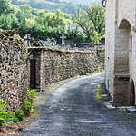 Cemetery street in the medieval city of Auxillac in France. Auxillac is a commune in the Lozere department in the Languedoc-Roussillon region in southeastern France.