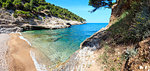 Summer Baia della Pergola small calm quiet beach, Gargano peninsula in Puglia, Italy. Two shots stitch panorama.