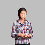 Winning concept. Asian girl shows well done with both hands, isolated on trendy gradient background