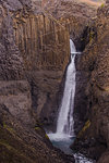 View of rock formation, erosion and waterfall, Hofn, Austur-Skaftafellssysla, Iceland