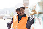 Male engineer on construction site inspecting construction materials