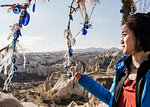 Woman enjoying view of rocky valley, Göreme, Cappadocia, Nevsehir, Turkey