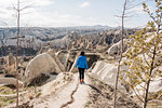 Woman hiking in rocky valley, Göreme, Cappadocia, Nevsehir, Turkey