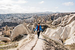 Woman hiking in rocky valley, Göreme, Cappadocia, Nevsehir, Turkey