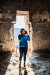 Woman taking photograph in Selime Monastery, Göreme, Cappadocia, Nevsehir, Turkey