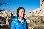 Woman exploring rocky valley, Göreme, Cappadocia, Nevsehir, Turkey