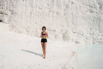 Woman enjoying cotton castle, Pamukkale, Denizli, Turkey