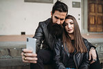 Couple taking selfie on steps