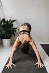 Woman practising yoga in studio