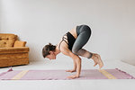 Woman practising yoga in studio