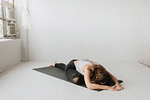 Woman practising yoga in studio