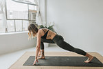 Woman practising yoga in studio