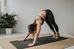 Woman practising yoga in studio