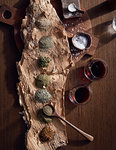 Variety of bush spices on log platter, a bush tucker dish using indigenous ingredients