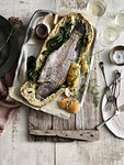 Whole fish baked in bread