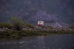 Camper carrying motorcycle parked by Squamish River, Howe Sound, Canada