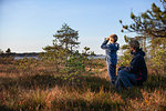 Father and son exploring forest, Finland